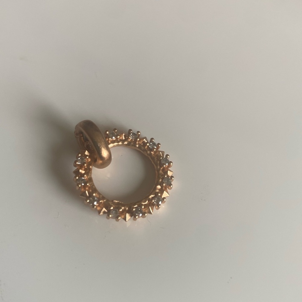 Kendra Scott Charm in Rose Gold.